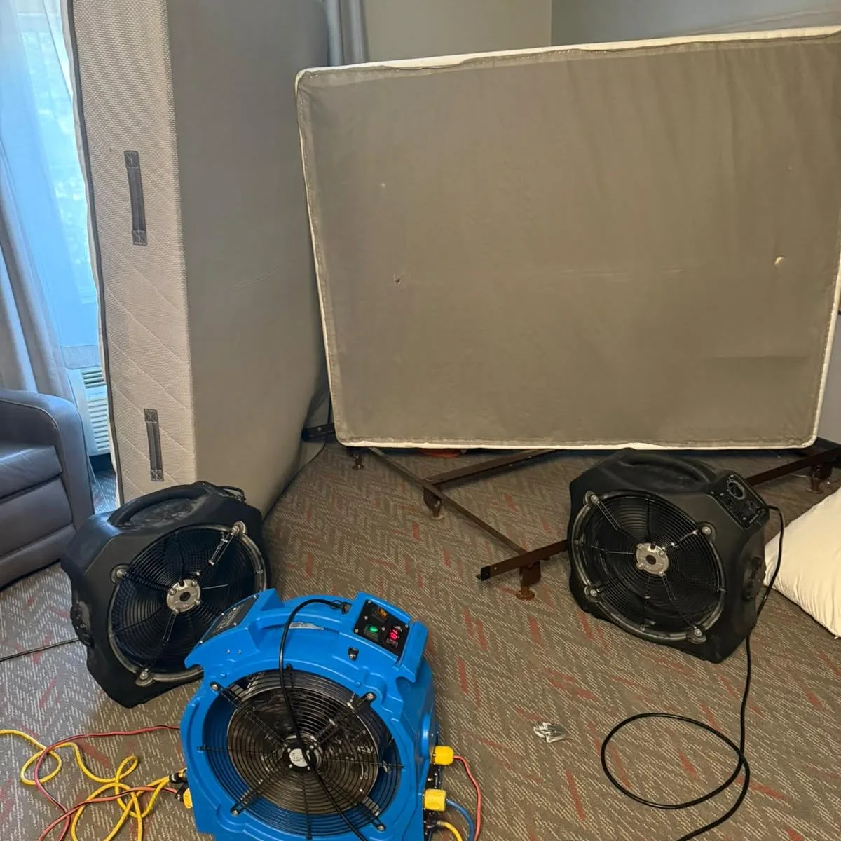 Bed bug heater and circulation fans running in a bedroom